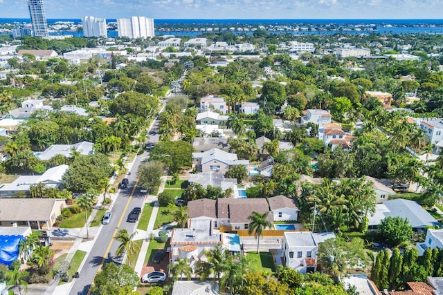 birds eye view of property featuring a water view and a residential view