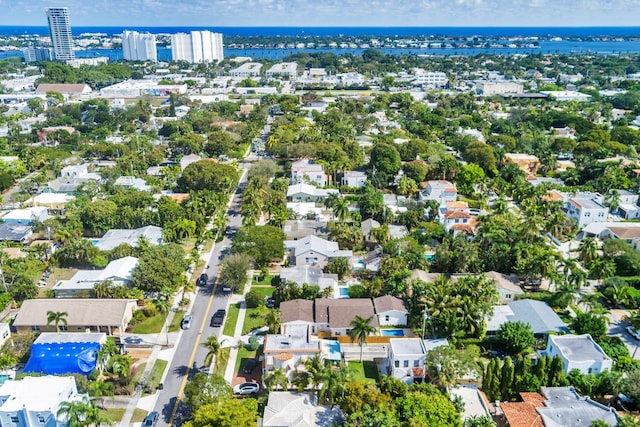 birds eye view of property featuring a water view and a residential view