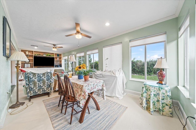 dining space featuring ornamental molding, built in features, and a textured ceiling