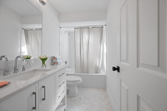 full bathroom featuring vanity, shower / tub combo with curtain, and toilet