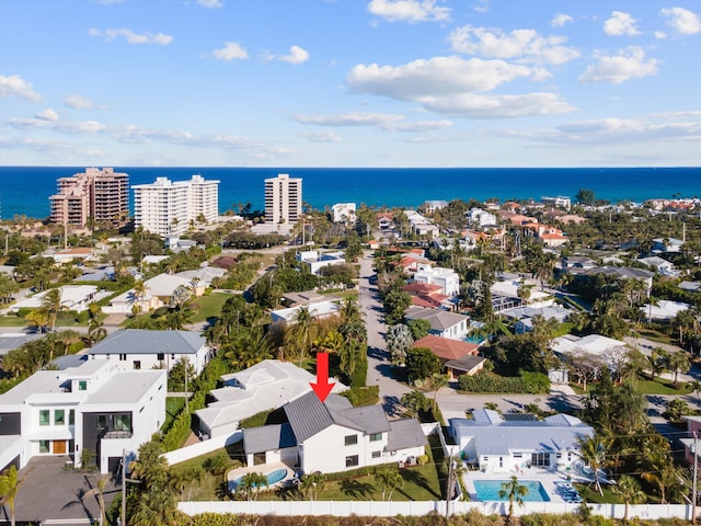 birds eye view of property with a water view