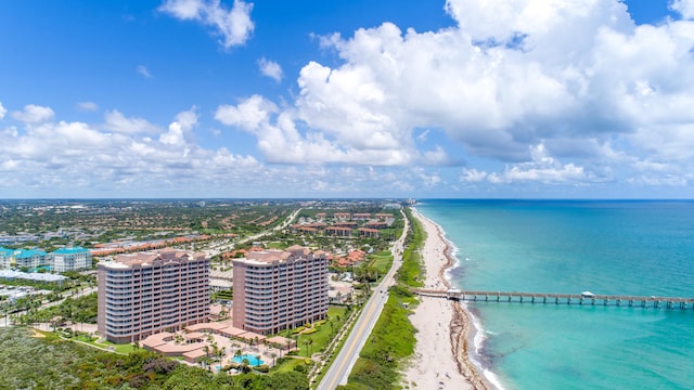 drone / aerial view featuring a view of the beach and a water view