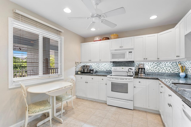 kitchen featuring white cabinetry, tasteful backsplash, light tile patterned floors, ceiling fan, and white appliances