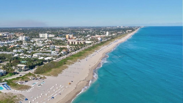 drone / aerial view with a view of the beach and a water view