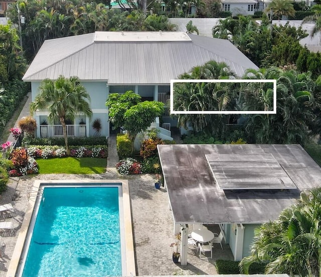 view of swimming pool featuring a patio area