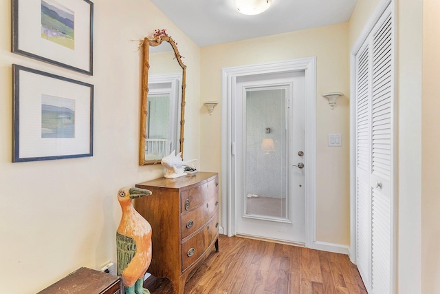 doorway to outside with light hardwood / wood-style flooring