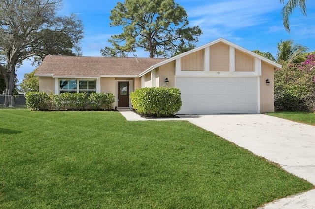 ranch-style house featuring a garage and a front yard