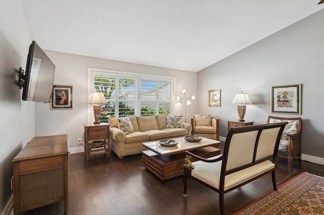 living room featuring lofted ceiling and dark hardwood / wood-style flooring