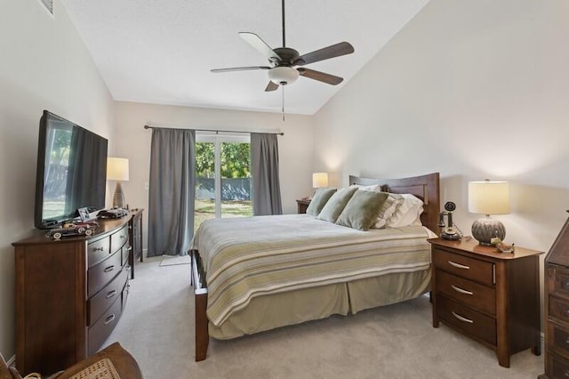 bedroom featuring ceiling fan, light colored carpet, lofted ceiling, and access to exterior