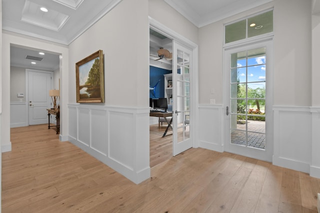 foyer entrance featuring french doors, ceiling fan, ornamental molding, and light hardwood / wood-style floors