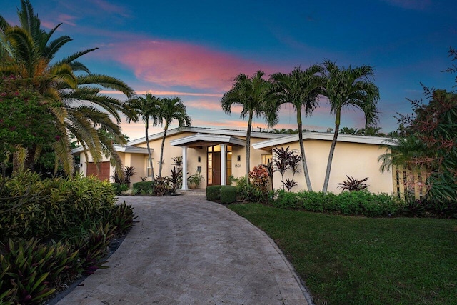 view of front of home with a lawn