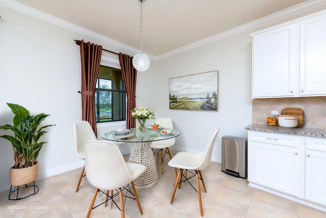 dining space featuring ornamental molding, baseboards, and light tile patterned floors