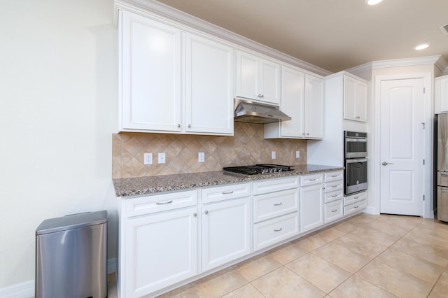 kitchen with stainless steel appliances, tasteful backsplash, stone countertops, white cabinets, and under cabinet range hood