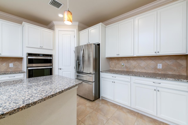 kitchen with visible vents, stainless steel appliances, light stone counters, and pendant lighting