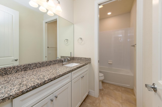 full bath featuring toilet, vanity, and tile patterned floors