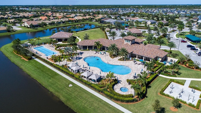 aerial view with a water view and a residential view