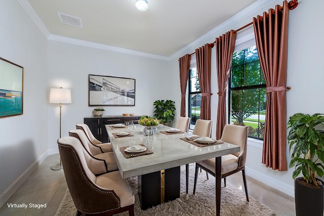 dining space featuring baseboards, light tile patterned floors, visible vents, and crown molding