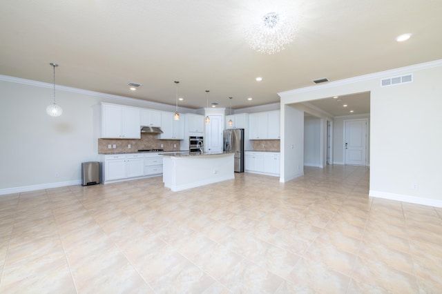 kitchen featuring tasteful backsplash, stainless steel fridge, visible vents, and under cabinet range hood