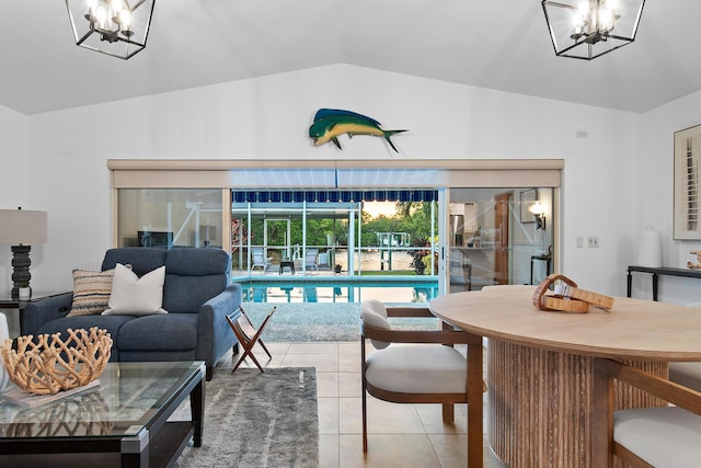 interior space featuring vaulted ceiling and a notable chandelier