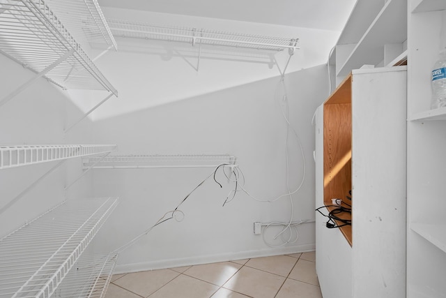 spacious closet featuring light tile patterned flooring