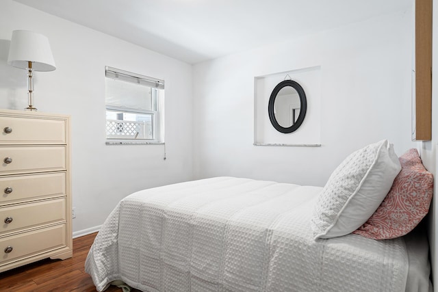 bedroom featuring dark hardwood / wood-style floors