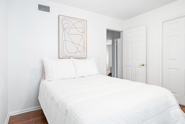 bedroom featuring dark hardwood / wood-style flooring