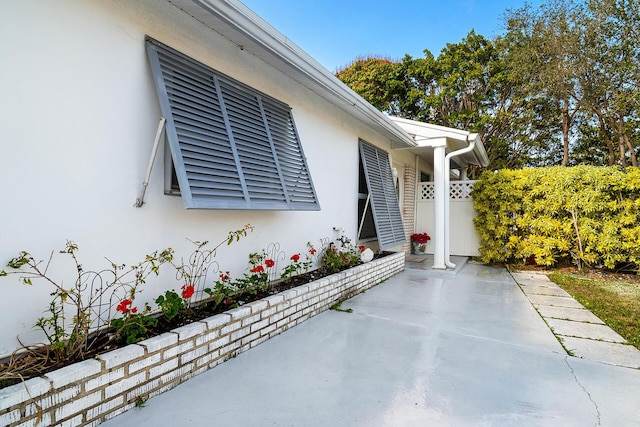 entrance to property featuring a patio