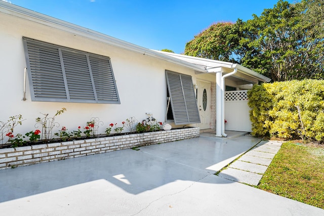 doorway to property featuring a patio