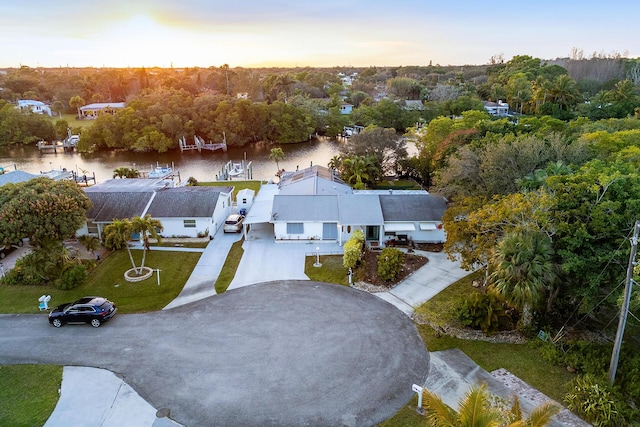 aerial view at dusk with a water view