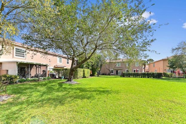 view of yard featuring a sunroom