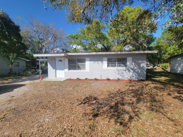 ranch-style home with a front yard