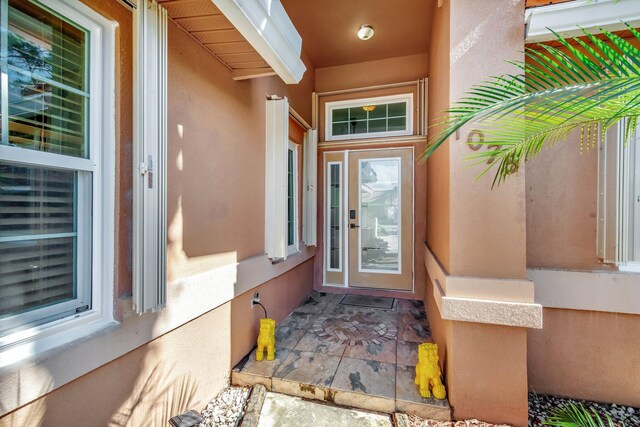 1075 E Lancewood Pl, Delray Beach, FL 33445 - entrance to property featuring stucco siding