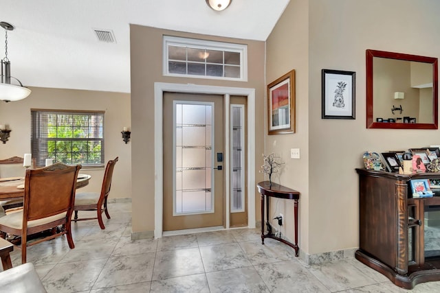 1075 E Lancewood Pl, Delray Beach, FL 33445 - foyer entrance with baseboards and vaulted ceiling