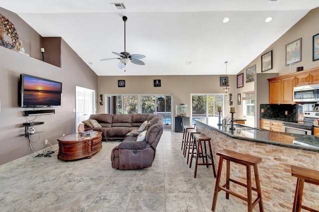 1075 E Lancewood Pl, Delray Beach, FL 33445 - living area with ceiling fan and high vaulted ceiling