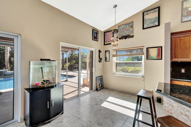 1075 E Lancewood Pl, Delray Beach, FL 33445 - dining area with high vaulted ceiling and baseboards