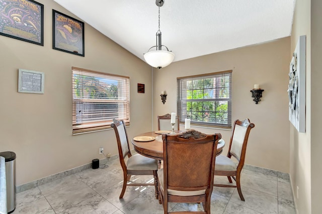 1075 E Lancewood Pl, Delray Beach, FL 33445 - dining room with lofted ceiling and baseboards