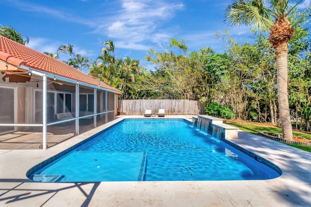 1075 E Lancewood Pl, Delray Beach, FL 33445 - view of swimming pool with a fenced backyard, a patio, and a sunroom
