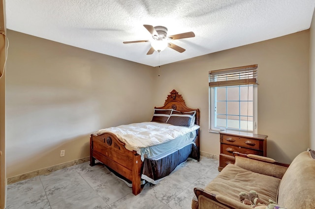 1075 E Lancewood Pl, Delray Beach, FL 33445 - bedroom featuring baseboards, a ceiling fan, a textured ceiling, and light marble finish flooring
