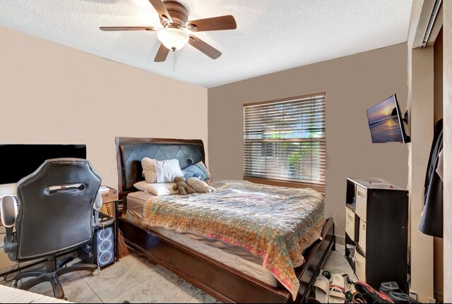 1075 E Lancewood Pl, Delray Beach, FL 33445 - bedroom with a textured ceiling and a ceiling fan