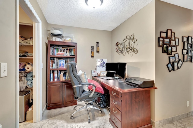 1075 E Lancewood Pl, Delray Beach, FL 33445 - home office with a textured ceiling and baseboards
