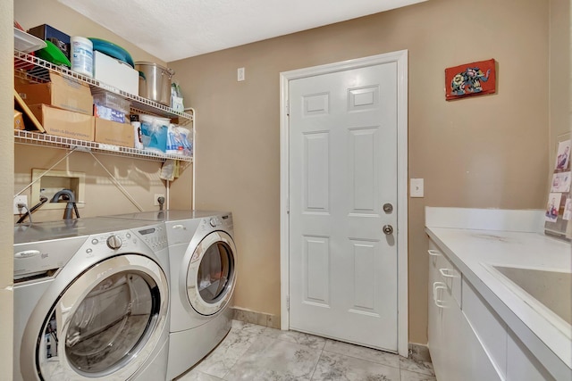 1075 E Lancewood Pl, Delray Beach, FL 33445 - washroom featuring washing machine and dryer, light marble finish floors, and baseboards