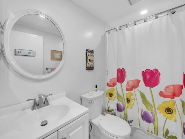 12 Valencia Unit A, Delray Beach, FL 33446 - bathroom with vanity, curtained shower, and toilet