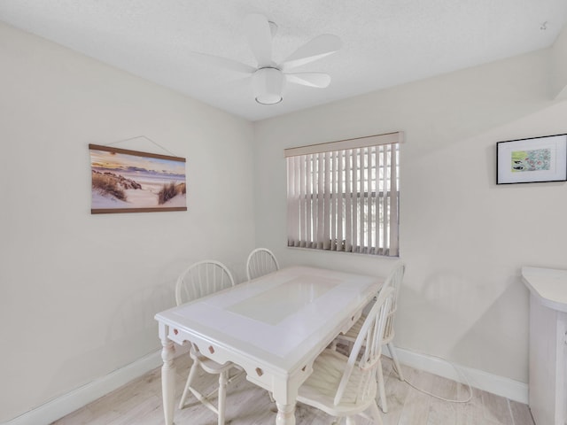 12 Valencia Unit A, Delray Beach, FL 33446 - dining room with baseboards, ceiling fan, and wood finished floors