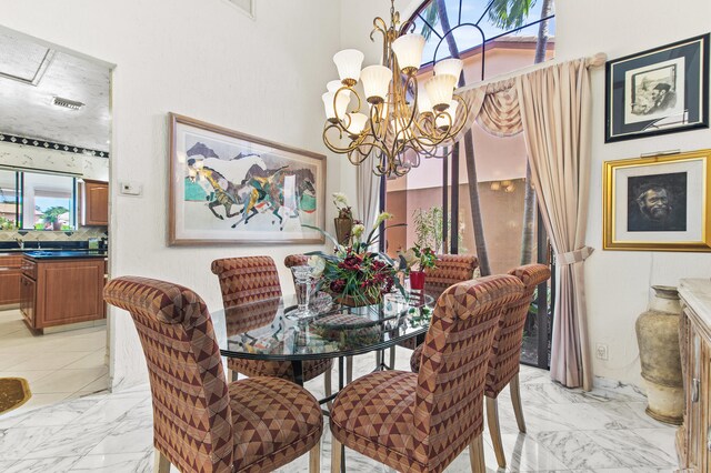 6525 Via Benita, Boca Raton, FL 33433 - dining area featuring visible vents, a notable chandelier, and marble finish floor