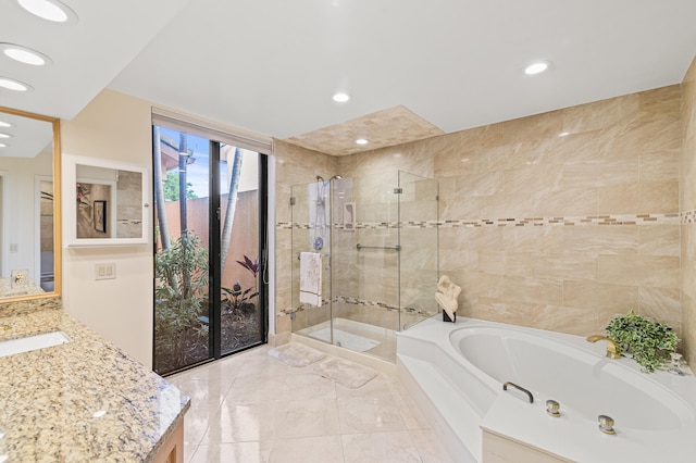 6525 Via Benita, Boca Raton, FL 33433 - full bath with recessed lighting, vanity, a garden tub, and a shower stall