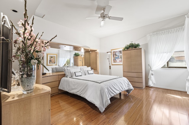 6525 Via Benita, Boca Raton, FL 33433 - bedroom featuring multiple windows, light wood-style floors, and ceiling fan
