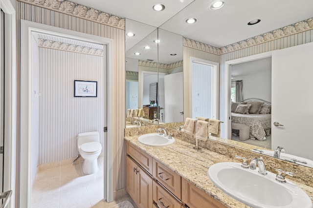 6525 Via Benita, Boca Raton, FL 33433 - ensuite bathroom with wallpapered walls, ensuite bath, tile patterned flooring, and a sink