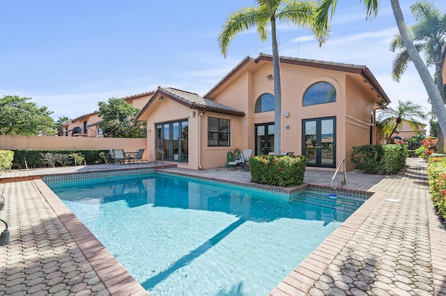 6525 Via Benita, Boca Raton, FL 33433 - view of swimming pool featuring a fenced in pool, french doors, a patio, and fence