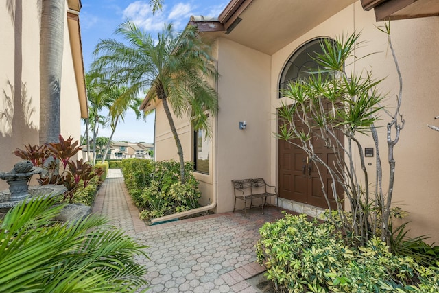 6525 Via Benita, Boca Raton, FL 33433 - view of exterior entry featuring stucco siding