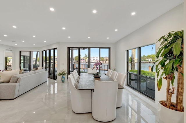 800 Andrews Ave Unit 9, Delray Beach, FL 33483 - dining room featuring plenty of natural light, a water view, and recessed lighting